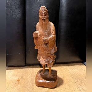 Chinese wood carved statue holding fish